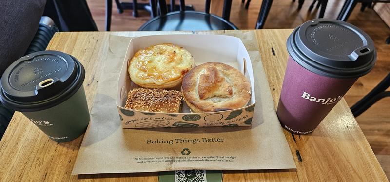 Four hours at the gathering place — A Banjo's box on a tray: a cheese-topped cauliflower pie, a scallop pie, a sesam