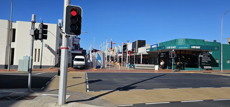 Four hours at the gathering place — Looking along the Rooke Street Mall from the traffic lights on Formby Road: a pe
