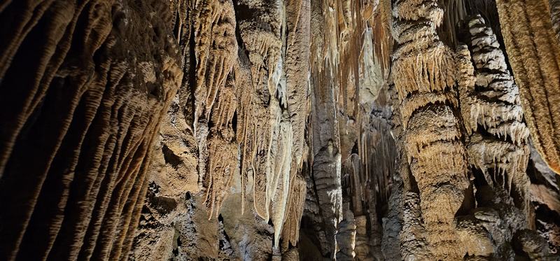 Weindorfer's mountain — A wall of shawls and stalactites, ribbed and folded, in cream and brown