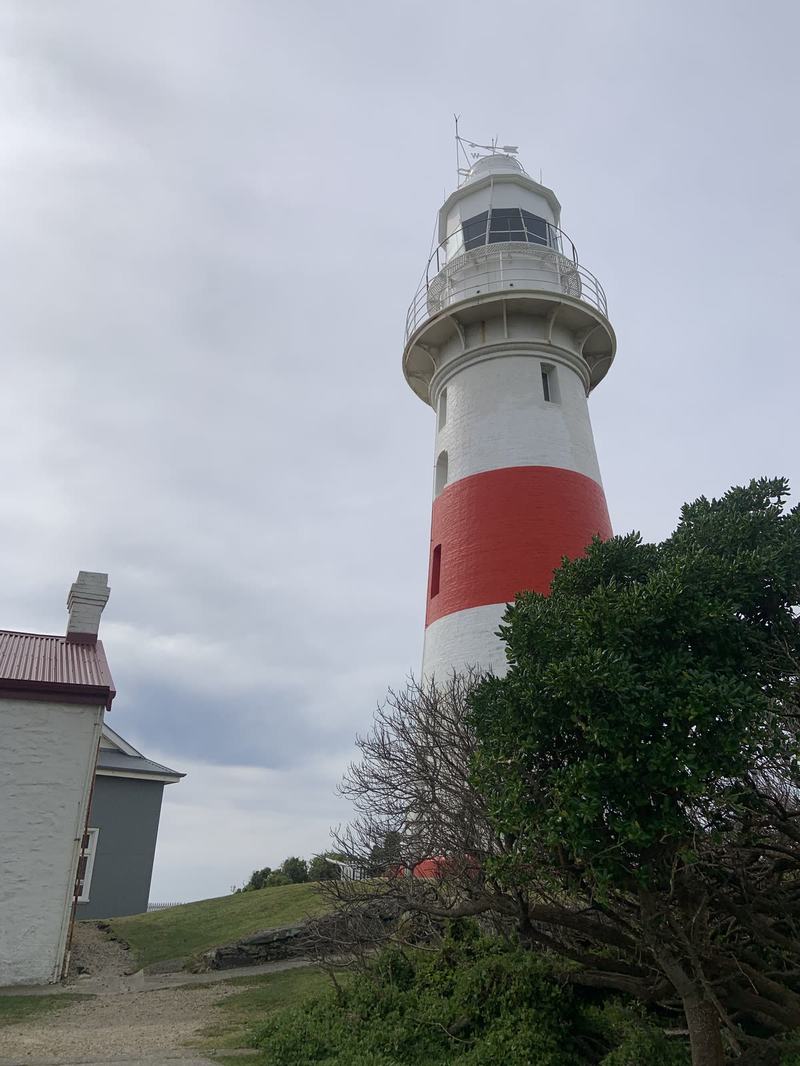 Up the Tamar — Low Head lighthouse with a whitewashed building beside it: the white tower with