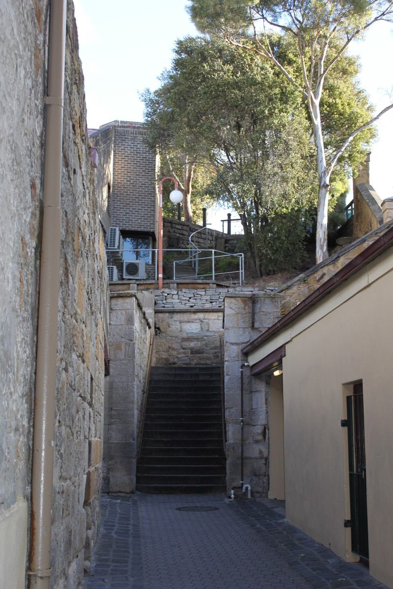 Cut into the cliff β Kelly's Steps: a narrow flight of stone steps between sandstone walls, climbing
