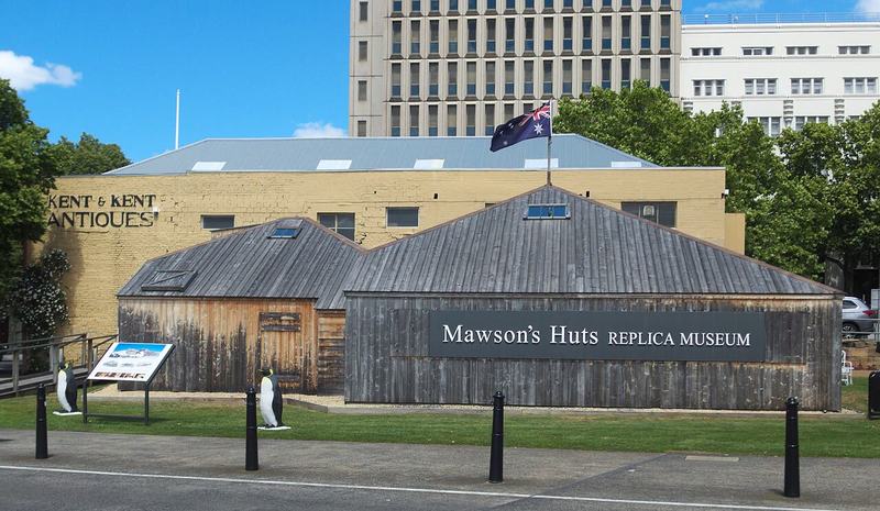 The city that faces south — The Mawson's Huts Replica Museum on the Hobart waterfront: two timber huts, peng