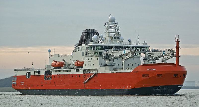 The city that faces south — The orange icebreaker Nuyina under way